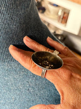 Load image into Gallery viewer, silver ring with a textured design against a blurred background