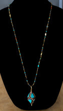 Load image into Gallery viewer, Long Brass African Beaded Necklace with Afghan Turquoise inlaid Bead pendant